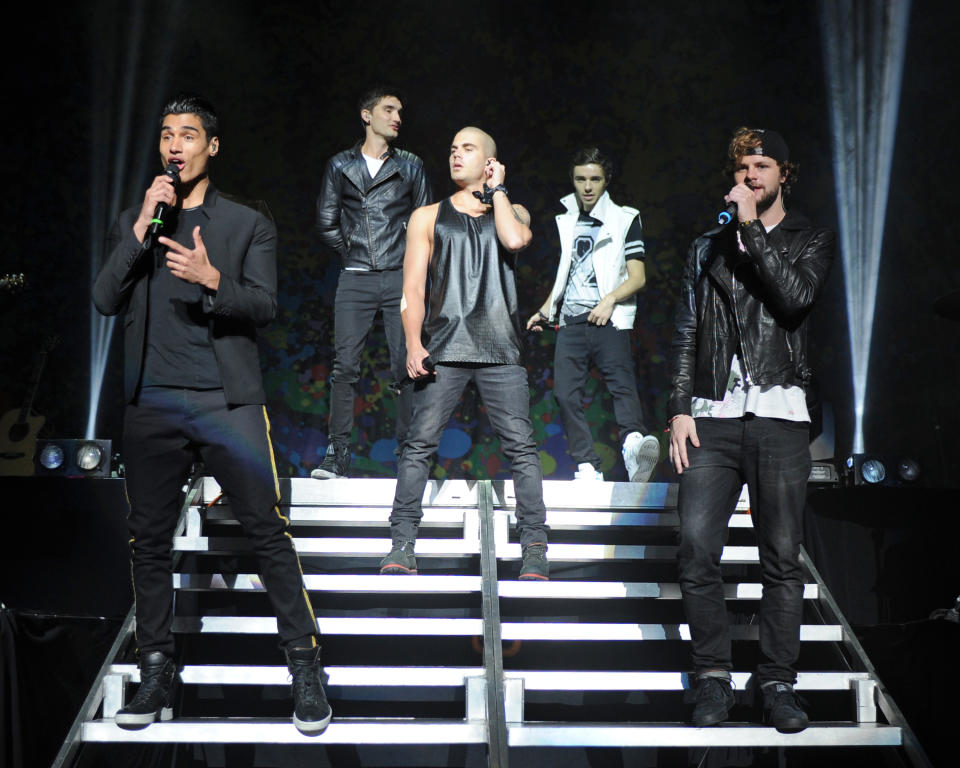 Tom Parker on stage with his bandmates Siva Kaneswaran, Max George, Nathan Sykes and Jay McGuiness. (Getty Images)