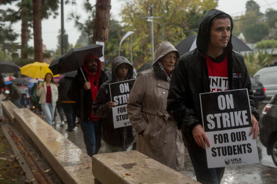 Teachers, students and supporters walk a picket line outside John Marshall High School in Los Angeles during a teachers strike spurred in part by public funding of charter schools, in January 2019. | Scott Heins—Bloomberg/Getty Images
