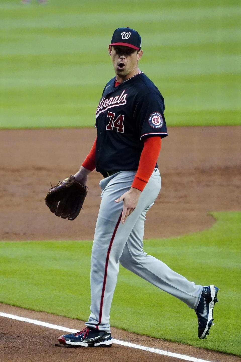 Washington Nationals pitcher Sean Nolin walks off the field after being ejected after hitting Atlanta Braves' Freddie Freeman with a pitch during the first inning of a baseball game Wednesday, Sept. 8, 2021, in Atlanta. (AP Photo/John Bazemore)