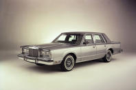 <p>The Lincoln Town Car was Ford’s answer to the likes of Cadillac, BMW and Mercedes long wheelbase saloons. Launched in 1980, the name had been around since the 1950s, but here was a car marketed directly at those who wanted to enjoy it from the back seat. Comfort takes precedent over handling and Town Car was for many years a mainstay of private chauffeurs in the USA, as well as in stretched form a limousine popular for <strong>weddings</strong>, and <strong>prom nights</strong>.</p><p>Power has always come from a V8 engine, with the earlier Town Cars using the <strong>4.9-litre Windsor V8</strong> before switching to 4.6-litre unit in later third generation models. Either way, performance is leisurely but suits the easy-going nature of this factory-made limo that can be bought from just <strong>$1000 </strong>in the US.</p>