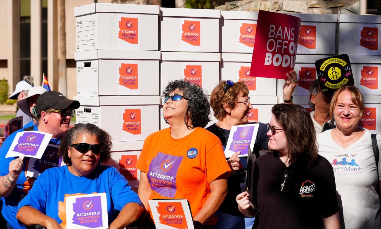 <span>Arizona abortion rights supporters deliver petition signatures to the state capitol to get abortion rights on the general election ballot last month.</span><span>Photograph: Ross D Franklin/AP</span>