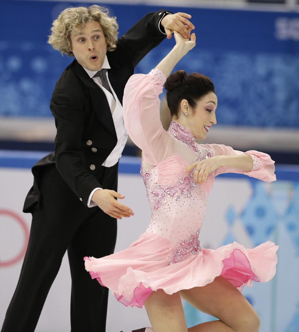 Meryl Davis and Charlie White of the United States compete in the ice dance short dance figure skating competition at the Iceberg Skating Palace during the 2014 Winter Olympics, Sunday, Feb. 16, 2014, in Sochi, Russia. (AP Photo/Darron Cummings)