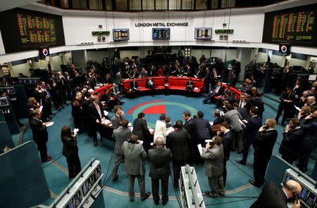 Traders and clerks react on the floor of the London Metal Exchange in the City of London February 14, 2012. REUTERS/Luke MacGregor/File Photo