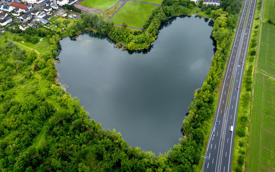 An aerial view of a heart-shaped lake in Rodgau, Germany, May 24, 2024. (AP Photo/Michael Probst, File)