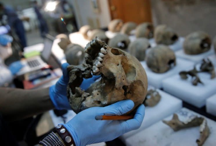 The National Institute of Anthropology and History (INAH) determined some of the skulls belonged to women and children (Reuters)