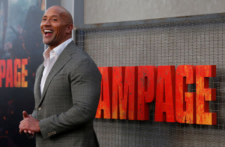 Cast member Dwayne Johnson poses at the premiere for the movie "Rampage" in Los Angeles, California, U.S., April 4, 2018. REUTERS/Mario Anzuoni