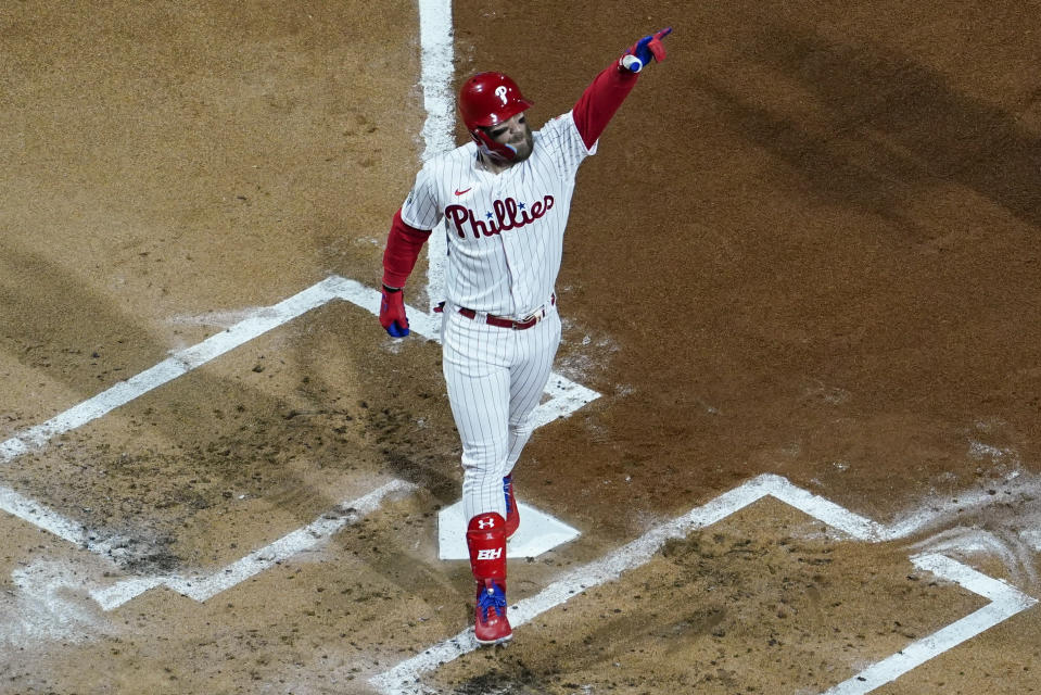 Philadelphia Phillies' Bryce Harper celebrates his two-run home run during the first inning in Game 3 of baseball's World Series between the Houston Astros and the Philadelphia Phillies on Tuesday, Nov. 1, 2022, in Philadelphia. (AP Photo/Matt Slocum)