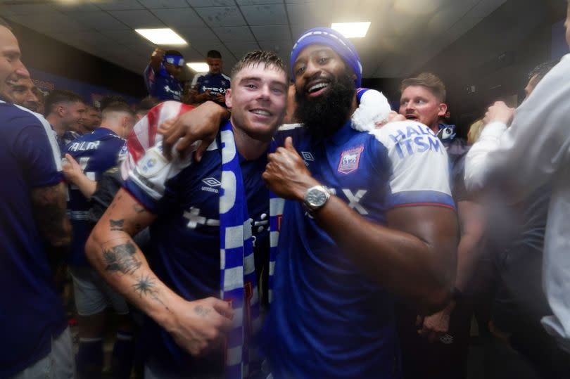 Ipswich Town's Leif Davis and Janoi Donacien celebrate promotion to the Premier League