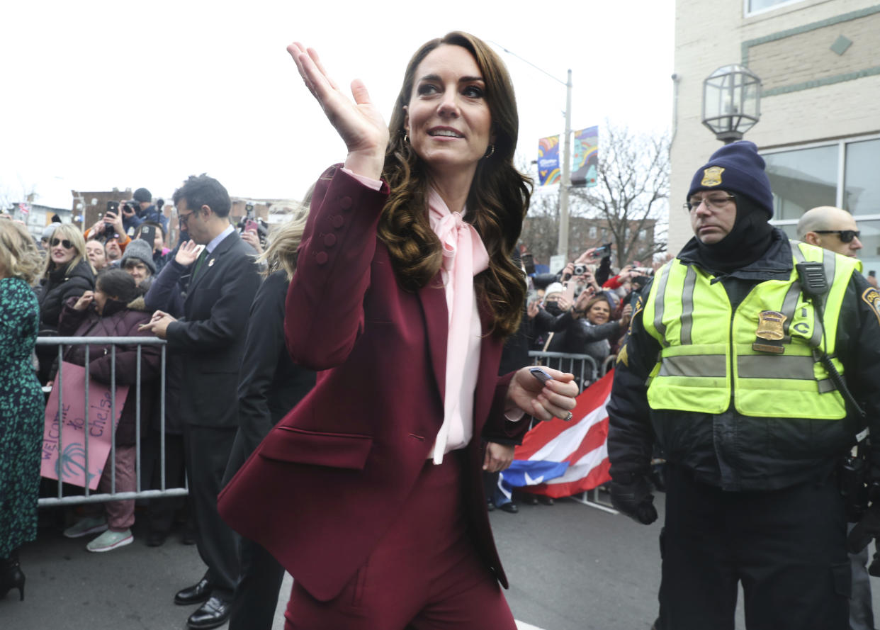 Kate, Princess of Wales, waves as she leaves after a visit to Roca on Thursday, Dec. 1, 2022, in Chelsea, Ma. (Nancy Lane/The Boston Herald via AP, Pool)