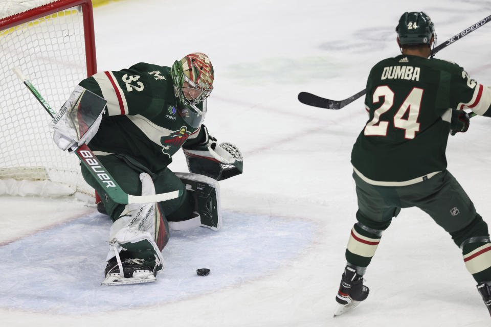 Minnesota Wild goaltender Filip Gustavsson (32) stops the puck during the first period of an NHL hockey game against the Boston Bruins, Sunday, March 18, 2023, in St. Paul, Minn. (AP Photo/Stacy Bengs)