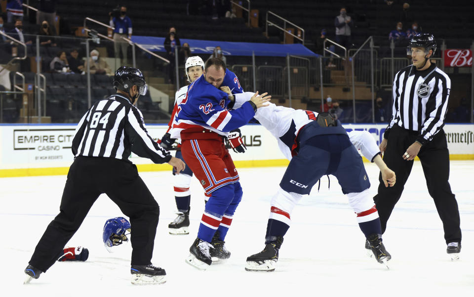 New York Rangers' Anthony Bitetto (22) and Washington Capitals' Michael Raffl (17) fight during the first period of an NHL hockey game Wednesday, May 5, 2021, in New York. (Bruce Bennett/Pool Photo via AP)