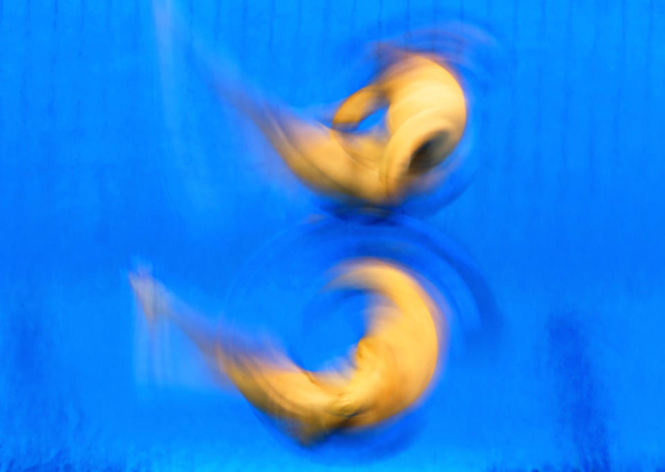 LONDON, ENGLAND - AUGUST 01: (L-R) Alexandre Despatie and Reuben Ross of Canada react as they compete in the Men's Synchronised 3m Springboard Diving on Day 5 of the London 2012 Olympic Games at the Aquatics Centre on August 1, 2012 in London, England. (Photo by Al Bello/Getty Images)