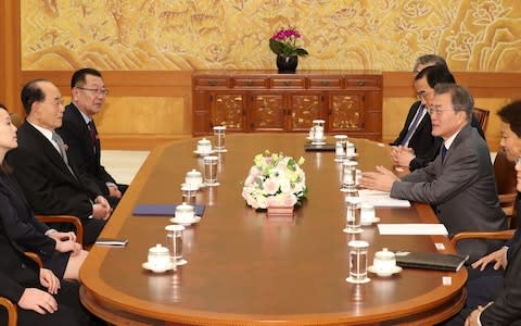 South Korean President Moon Jae-in talks Kim Young Nam and Kim Yo Jong during their meeting at the Presidential Blue House in Seoul - Credit: Reuters