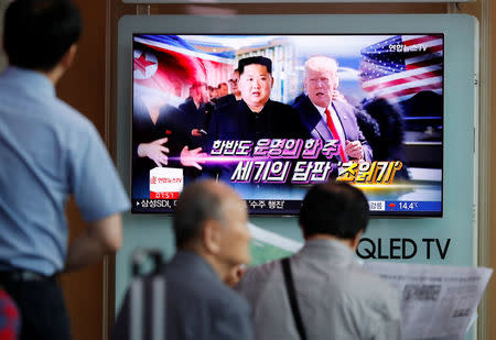 People watch a TV broadcasting a news report on the upcoming summit between the U.S. and North Korea, in Seoul, South Korea, June 11, 2018. REUTERS/Kim Hong-Ji