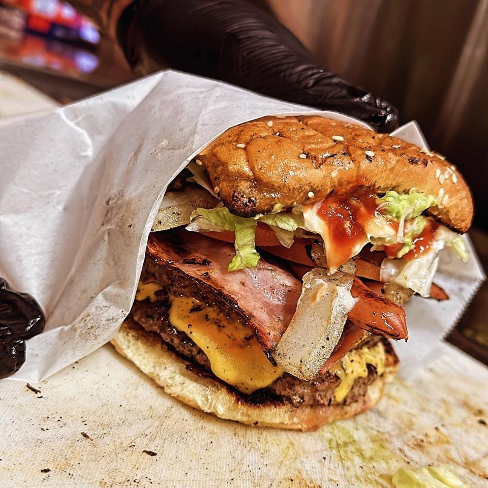 El Semmy Double, a Juarez style hamburger at Ceezy F Tacos in Alamogordo. El Semmy has a beef patty, a slice of ham, a hot dog, lettuce mayo, ketchup and cheese. Ceezy F Tacos is located at 200 Cuba Avenue.