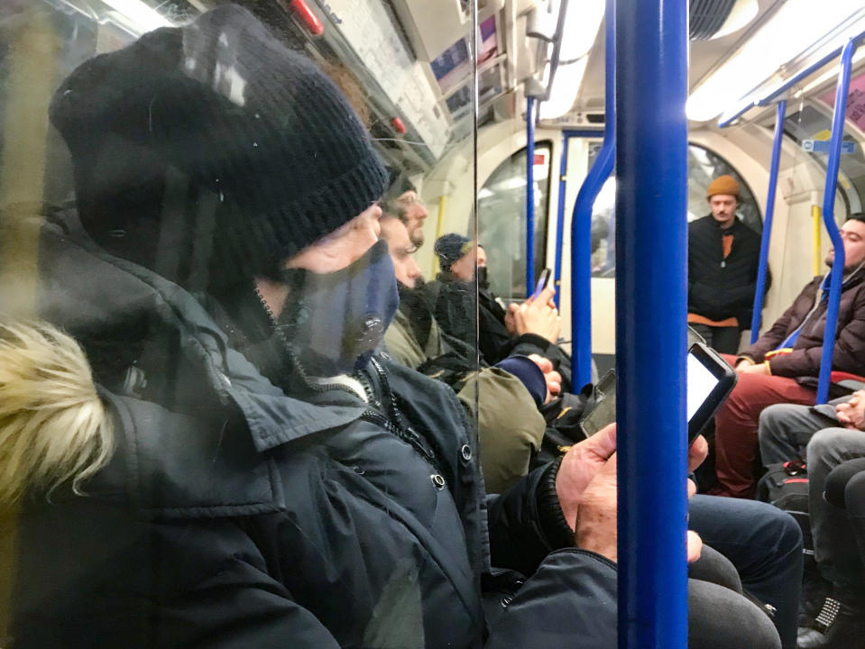 A man wears a mask on the Piccadilly Line on the Underground, London. Prime Minister Boris Johnson has said it is "highly likely" the UK will see a growing number of coronavirus cases, but stressed that "for the vast majority of people in this country we should be going about our business as usual".