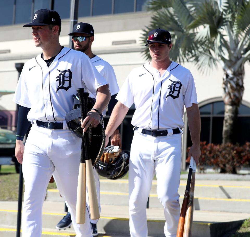 (From left) Tigers prospects Spencer Torkelson, Riley Greene and Colt Keith take the field for workouts during spring training Minor League minicamp Monday, Feb. 21, 2022 at Tiger Town in Lakeland, Florida.