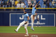 Tampa Bay Rays second baseman Amed Rosario, left, and shortstop Jose Caballero celebrate after the team defeated the Los Angeles Angels 2-1 in a baseball game Thursday, April 18, 2024, in St. Petersburg, Fla. (AP Photo/Chris O'Meara)