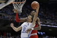 North Carolina guard Cole Anthony (2) drives to the basket while Ohio State forward Alonzo Gaffney defends during the first half of an NCAA college basketball game in Chapel Hill, N.C., Wednesday, Dec. 4, 2019. (AP Photo/Gerry Broome)