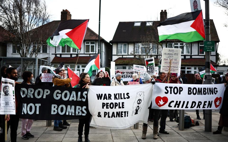 'Drop goals not bombs', says one of the banners