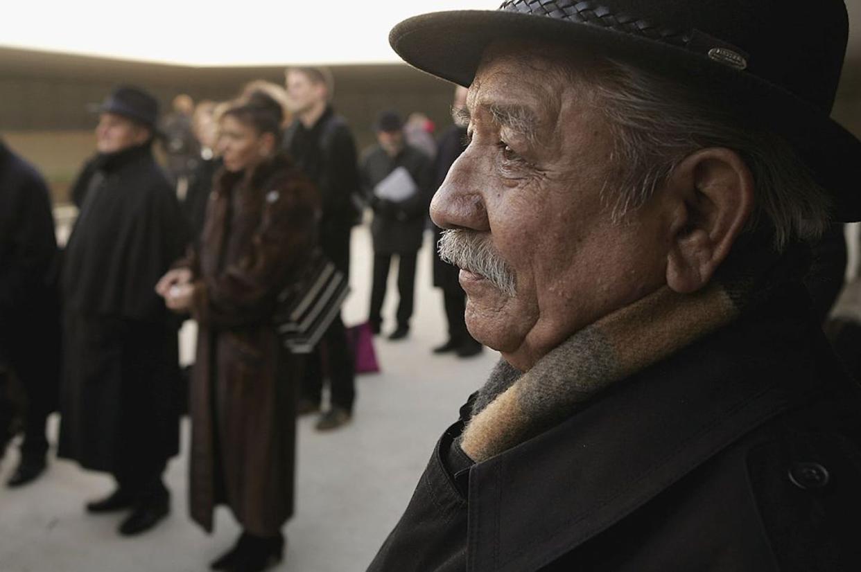 Franz Roselbach, a Roma survivor of the Holocaust who was sent to Auschwitz when he was 15, attends a ceremony at the former Sachsenhausen concentration camp in 2006. <a href="https://www.gettyimages.com/detail/news-photo/roma-survivor-of-the-holocaust-franz-roselbach-who-was-sent-news-photo/72830867?adppopup=true" rel="nofollow noopener" target="_blank" data-ylk="slk:Sean Gallup/Getty Images;elm:context_link;itc:0;sec:content-canvas" class="link ">Sean Gallup/Getty Images</a>