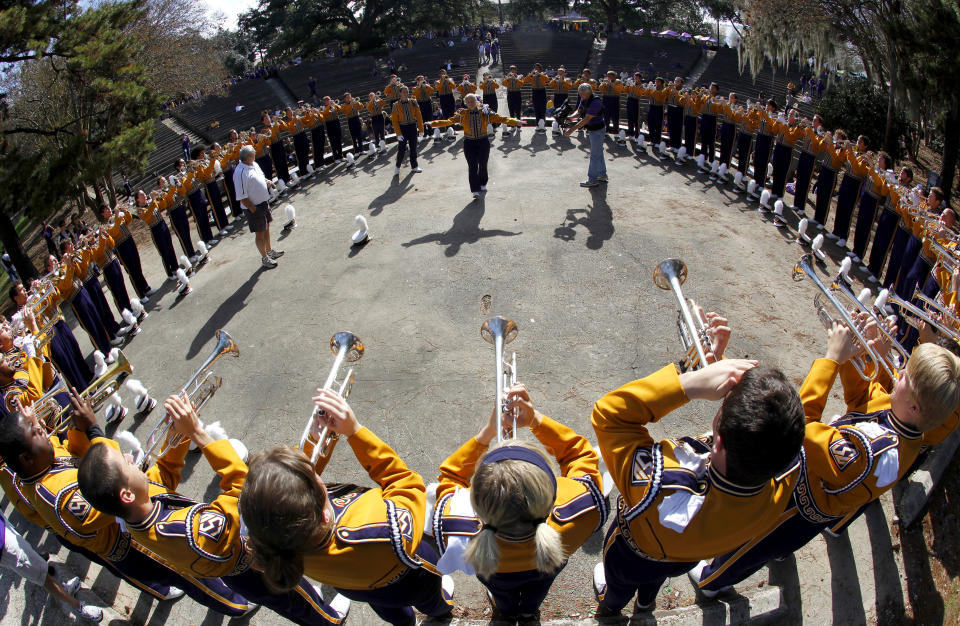 Members of the Louisiana State University Marching Band warm up before their game against the University of Arkansas during their NCAA football game in Baton Rouge, Louisiana November 25, 2011. REUTERS/Sean Gardner (UNITED STATES - Tags: SPORT FOOTBALL)