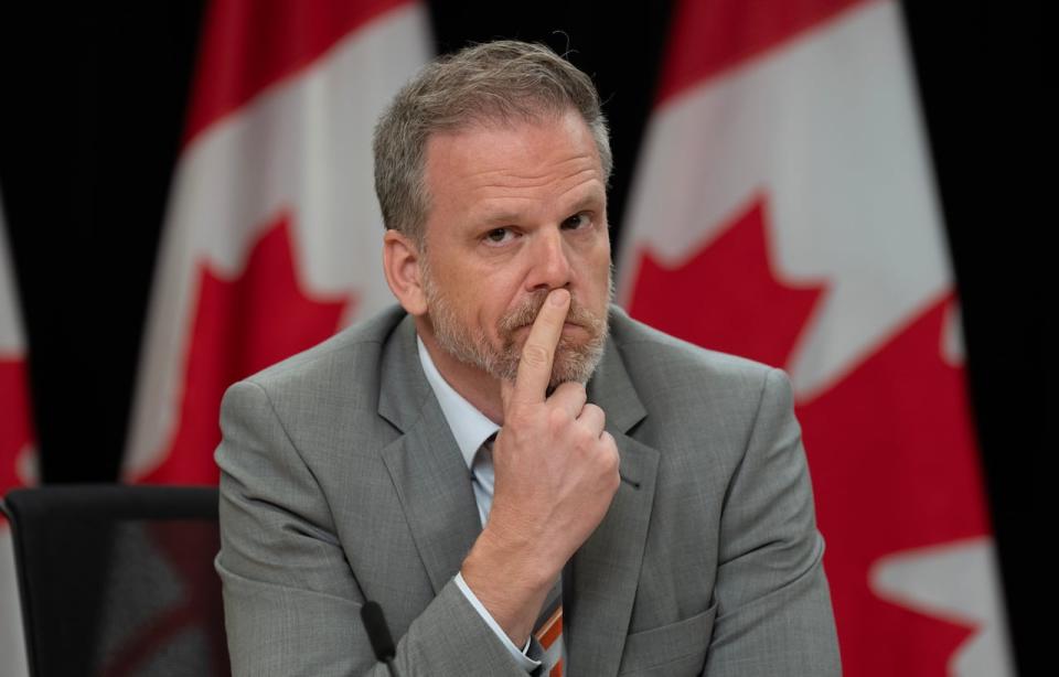 Minister of Health Mark Holland listens to a speaker during a news conference in Ottawa, Tuesday, June 18, 2024.