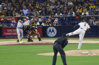 Milwaukee Brewers' Christian Yelich hits a single against the San Diego Padres during the sixth inning of a baseball game Tuesday, May 24, 2022, in San Diego. (AP Photo/Mike McGinnis)