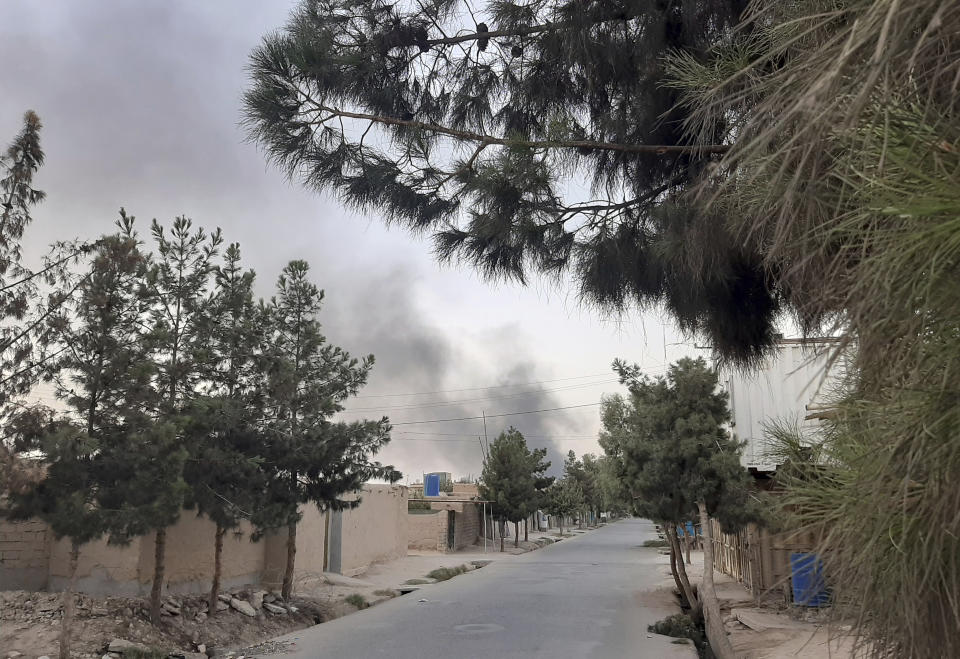 Smoke rises from the city of Lashkar Gah after airstrikes against Taliban in Helmand province southern of Kabul, Afghanistan, Friday, Aug. 6, 2021. The Afghan air force carried out more airstrikes against Taliban positions in southern Afghanistan on Thursday, as the insurgent force made additional gains in the country's north. (AP Photo/Abdul Khaliq)