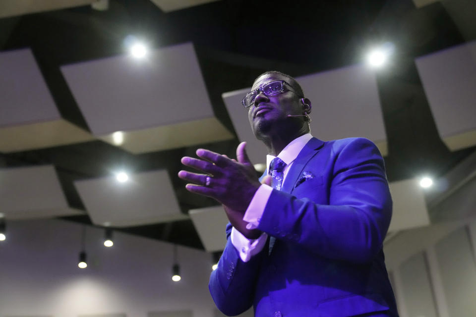 Pastor Les Robinson applauds as he waits to deliver his sermon at The Sanctuary Church Sunday, May 14, 2023, in Santa Clarita, Calif. For Black Californians who have watched for nearly two years as the state has come further than any other in its consideration of reparations for African Americans, the approval of restitution proposals by a historic task force marks a moment some never thought would come and one others say is a long time coming. (AP Photo/Marcio Jose Sanchez)