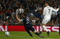 Football Soccer - Real Madrid v Malmo - Champions League Group Stage - Group A - Santiago Bernabeu, Madrid, Spain - 8/12/15 Real Madrid's Cristiano Ronaldo scores the sixth goal past Malmo's Kari Arnason. REUTERS/Juan Medina