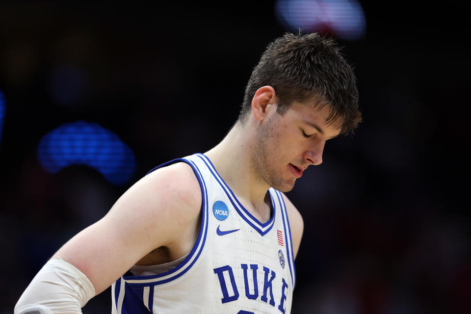 DALLAS, TEXAS - MARCH 31:  Kyle Filipowski #30 of the Duke Blue Devils reacts after a foul in the Elite 8 round of the NCAA Men's Basketball Tournament against the North Carolina State Wolfpack at American Airlines Center on March 31, 2024 in Dallas, Texas. (Photo by Patrick Smith/Getty Images)