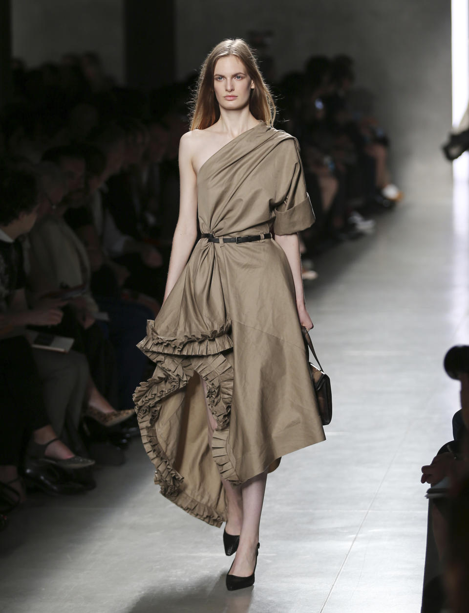 A model wears a creation for Bottega Veneta's women's Spring-Summer 2014 collection, part of the Milan Fashion Week, unveiled in Milan, Italy, Saturday, Sept. 21, 2013. (AP Photo/Antonio Calanni)