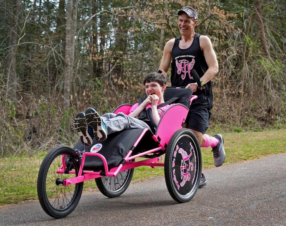 “If what we’re doing can inspire one person to try to do something that they normally couldn’t do, then we’ve done more than we ever thought possible,” says Bill Johncock, photographed in Hickory with his son Logan.