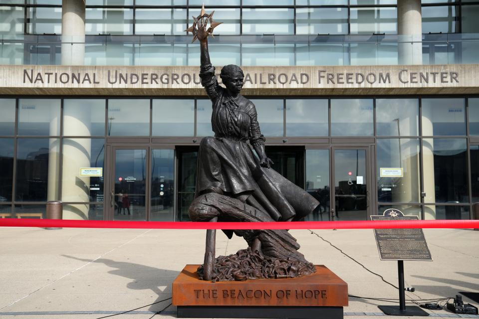 An 11-foot bronze statue honoring the most famous conductor of the Underground Railroad, Harriet Tubman, was presented, Monday, March 4, 2024, at the National Underground Railroad Freedom Center in Downtown Cincinnati. Titled, “The Beacon of Hope,” the statue features Tubman lifting her right hand to the sky representing a shining North Star. The statue will be on display through April 30.