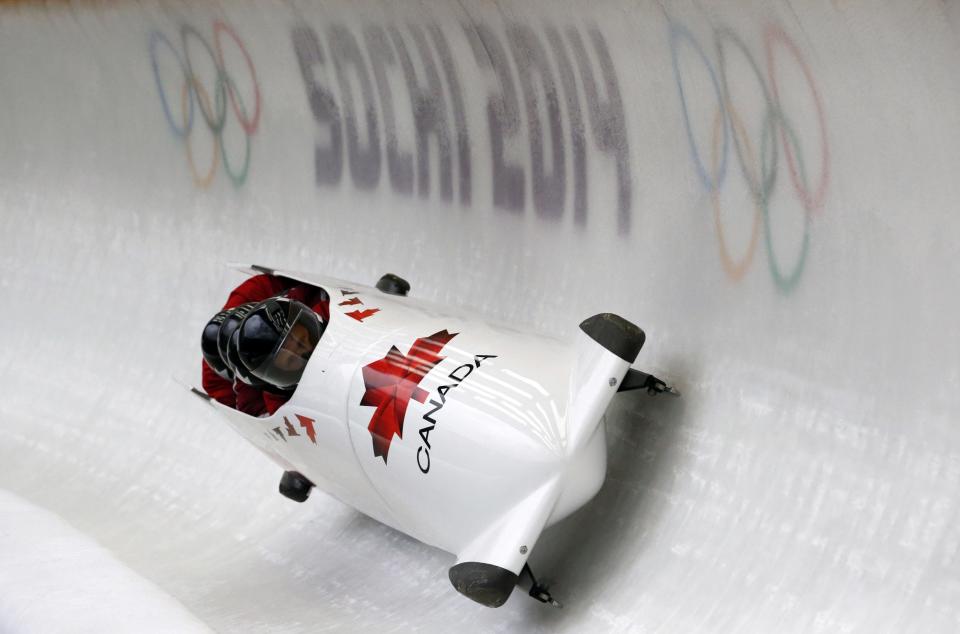 Canada's pilot Lyndon Rush and his teammates speed down the track during a four-man bobsleigh training session at the Sanki Sliding Center in Rosa Khutor, during the Sochi 2014 Winter Olympics near Sochi, February 21, 2014. REUTERS/Fabrizio Bensch (RUSSIA - Tags: SPORT BOBSLEIGH OLYMPICS)