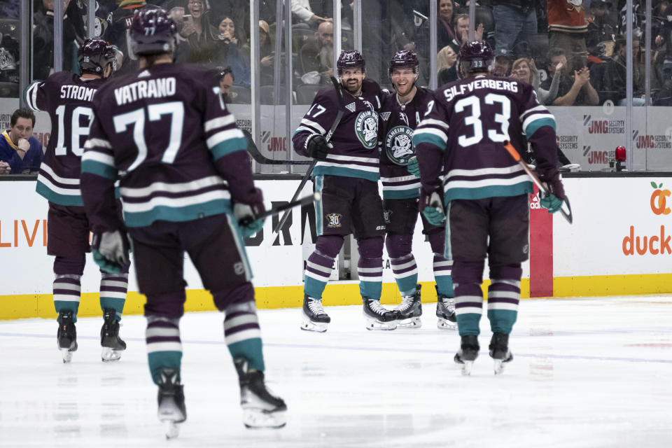 Anaheim Ducks players celebrate a goal by left wing Alex Killorn (17) during the third period of an NHL hockey game against the Los Angeles Kings Tuesday, April 9, 2024, in Anaheim, Calif. (AP Photo/William Liang)