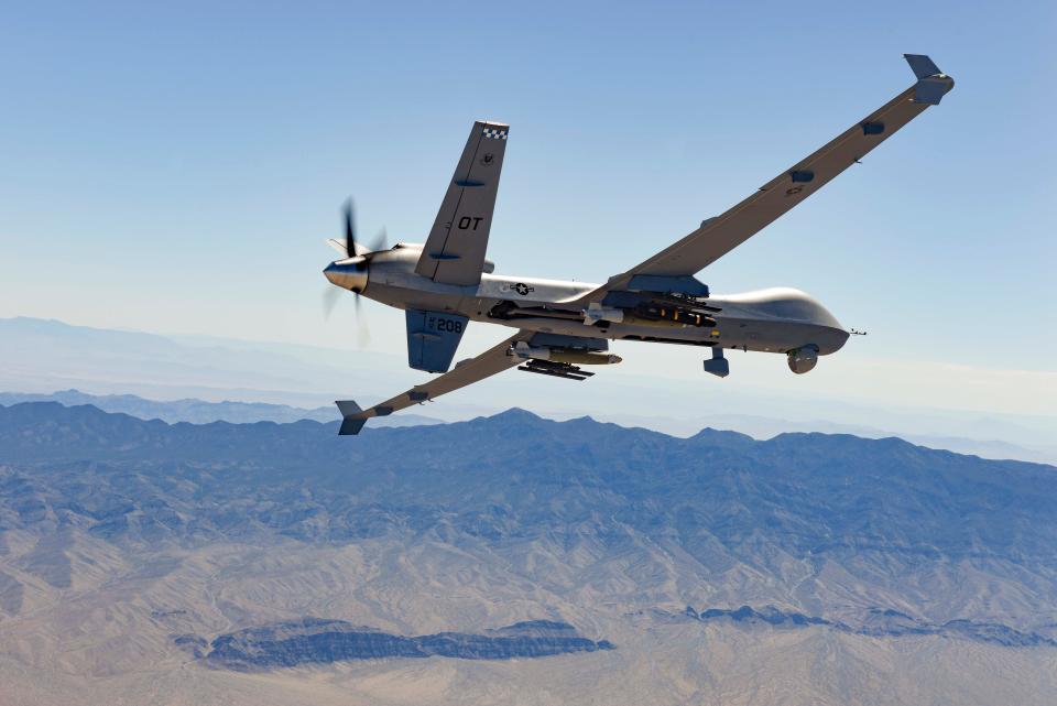 An MQ-9 Reaper remotely piloted aircraft piloted by Airmen from the 556 Test and Evaluation Squadron flies over the Nevada Test and Training Range and performs live-fire exercises with Air-to-Ground Missile-114 Hellfire missiles and Guided Bomb Unit-12 Paveway IIs, Aug. 30, 2023.
