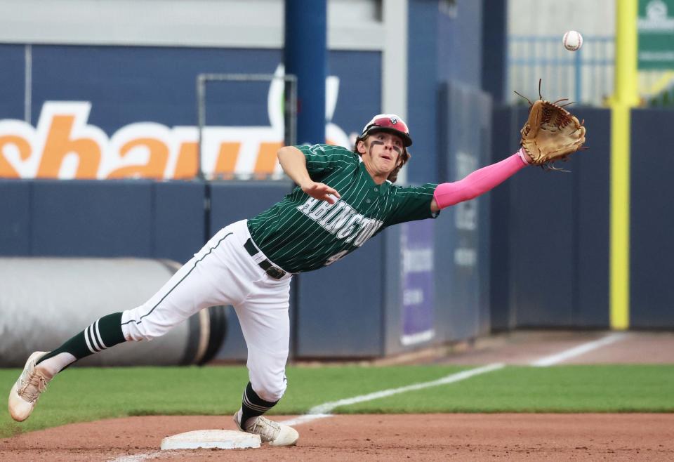Abington third baseman Henry Rogers reaches for a throw on a stolen-base attempt in the Div. 4 state championship game at Polar Park in Worcester on Sunday, June 18, 2023.