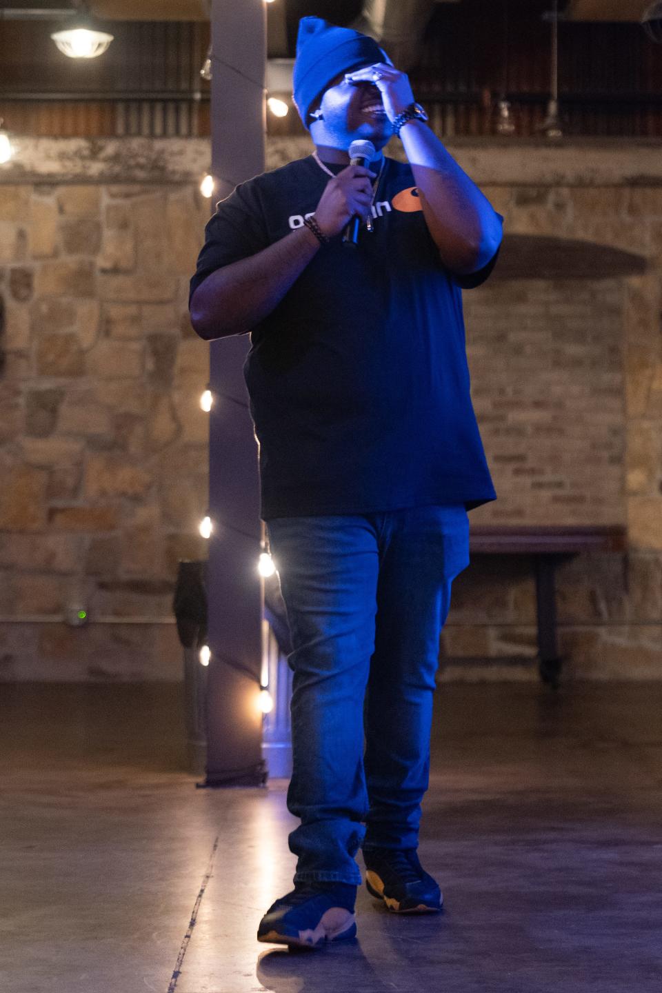 Topeka comedian JaWon Wheat acts out a joke during his six-minute routine at Thursday's Top City Comedy competition at The Foundry.