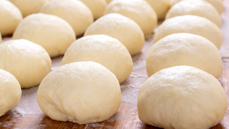 dough balls lined up for second rise