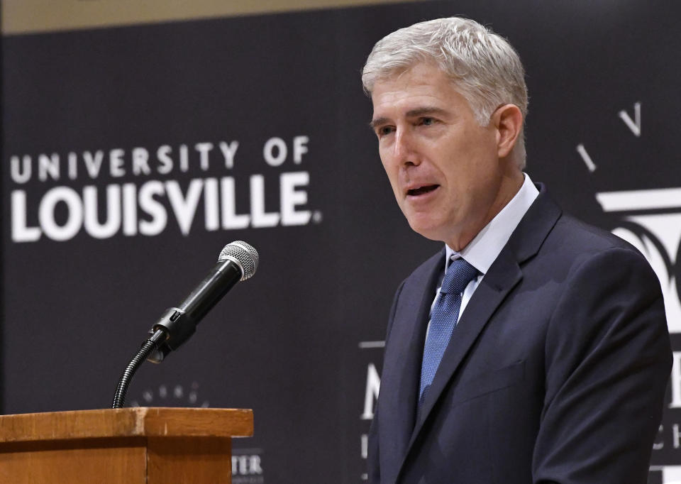 FILE - Supreme Court Justice Neil Gorsuch speaks to an audience as a guest of Sen. Mitch McConnell, R-Ky., at the University of Louisville, Sept. 21, 2017, in Louisville, Ky. Records obtained by The Associated Press show that Supreme Court justices have attended publicly funded events at colleges and universities that allowed the schools to put the justices in the room with influential donors, including some whose industries have had interests before the court. (AP Photo/Timothy D. Easley, File)