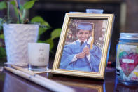 A photo of Eric Cruz as a 5-year-old pre-schooler rests on a table at the home of his mother, Dolores, on Wednesday, Feb. 1, 2023, in San Gabriel, Calif. Dolores Cruz published an essay in 2022 about grieving for her son, Eric, who died in a car crash in 2017. "Died Suddenly" used a screenshot of the headline in the film, portraying his death as vaccine related. (AP Photo/Marcio Jose Sanchez)