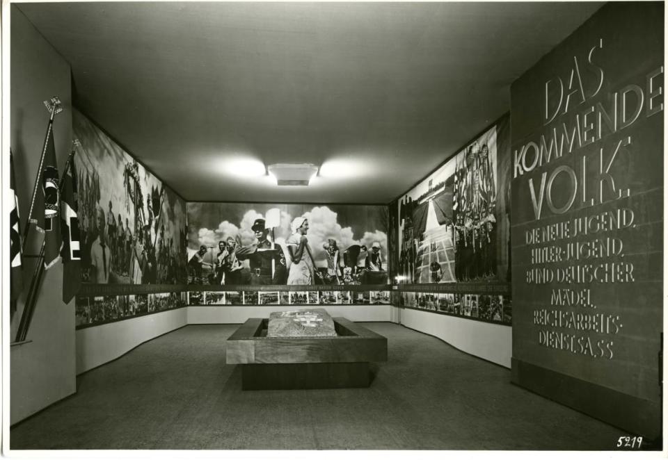 <div class="inline-image__caption"><p>The <i>Deutschland</i> exhibition: 'the coming nation' display on youth organizations, 1936.</p></div> <div class="inline-image__credit">Courtesy Dittrick Medical History Center, Case Western Reserve University. </div>