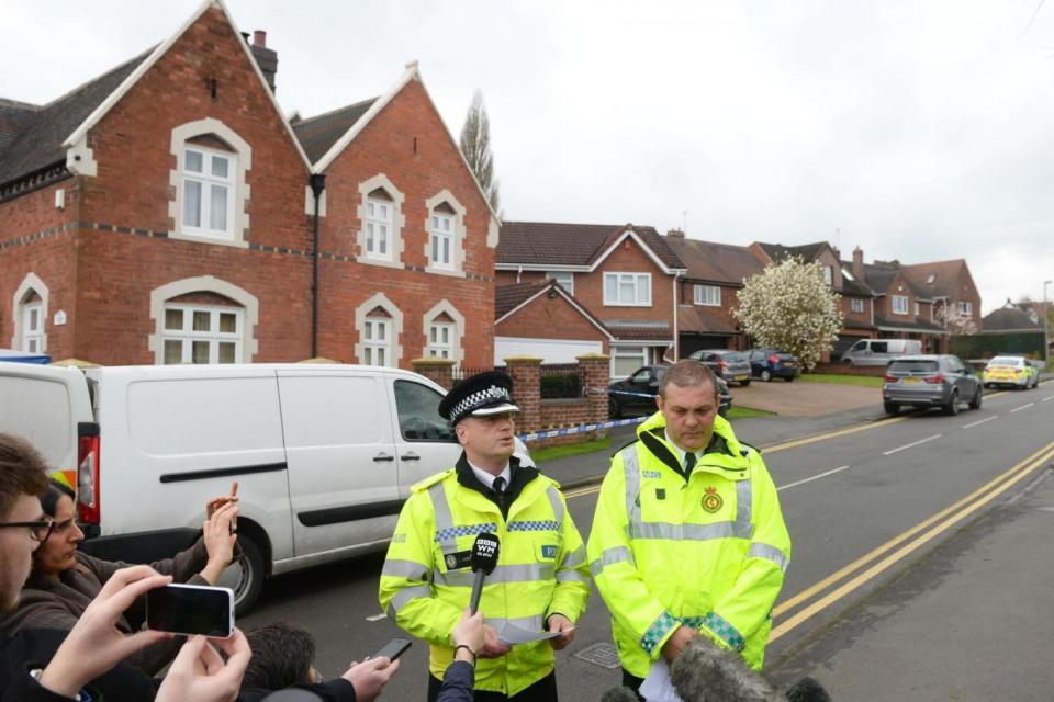 West Midlands Police Officers speak at the scene (PA)