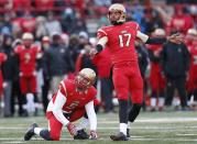 Laval Rouge et Or kicker Boris Bede (R) and holder Tristan Grenon watch a field goal against the Calgary Dinos during the second half of the Vanier Cup University Championship football game in Quebec City, Quebec, November 23, 2013. REUTERS/Mathieu Belanger (CANADA - Tags: SPORT FOOTBALL)
