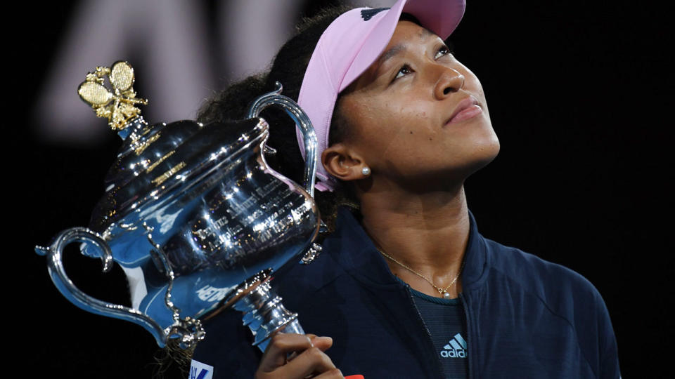 Naomi Osaka holds aloft her second grand slam trophy – the Daphne Akhurst Memorial Cup. Pic: Getty