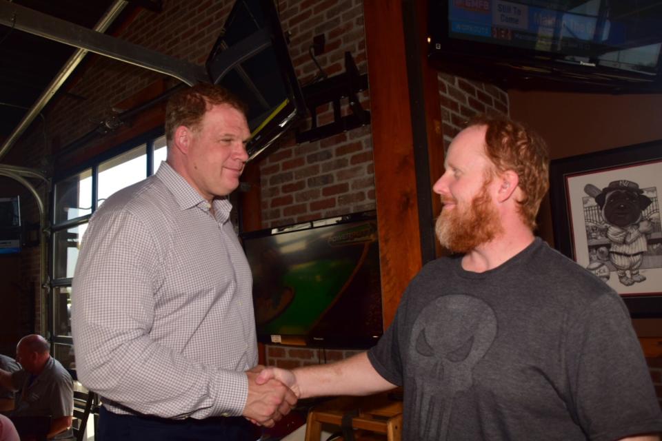 Knox County Mayor Glenn Jacobs shakes hands with Joshua Bolling during an “Eat and Greet” session at Double Dogs in Hardin Valley on May 24, 2019.