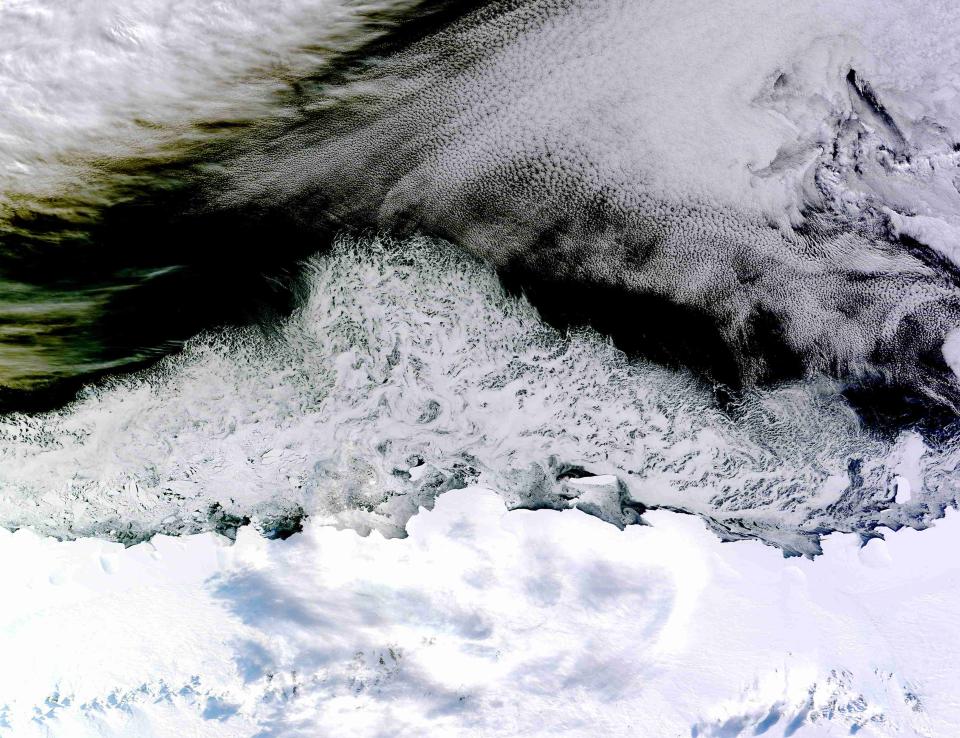 Natural-color sea ice off the coast of East Antarctica�s Princess Astrid Coast is seen in this picture from the Moderate Resolution Imaging Spectroradiometer (MODIS) on NASA�s Terra satellite acquired April 5, 2015 and released April 8, 2015. White areas close to the continent are sea ice, while white areas in the northeast corner of the image are clouds. The image was acquired after Antarctic sea ice had passed its annual minimum extent (reached on Feb. 20, 2015), and had resumed expansion toward its maximum extent (usually reached in September). Picture taken April 5, 2015. REUTERS/NASA/Jeff Schmaltz, LANCE/EOSDIS Rapid Response/Handout via Reuters THIS IMAGE HAS BEEN SUPPLIED BY A THIRD PARTY. IT IS DISTRIBUTED, EXACTLY AS RECEIVED BY REUTERS, AS A SERVICE TO CLIENTS. FOR EDITORIAL USE ONLY. NOT FOR SALE FOR MARKETING OR ADVERTISING CAMPAIGNS