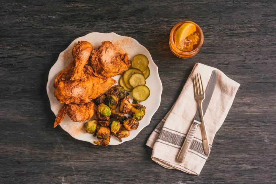 One of Tupelo Honey’s signature dishes is the Sweet & Spicy Fried Chicken, smothered in sriracha honey sauce.